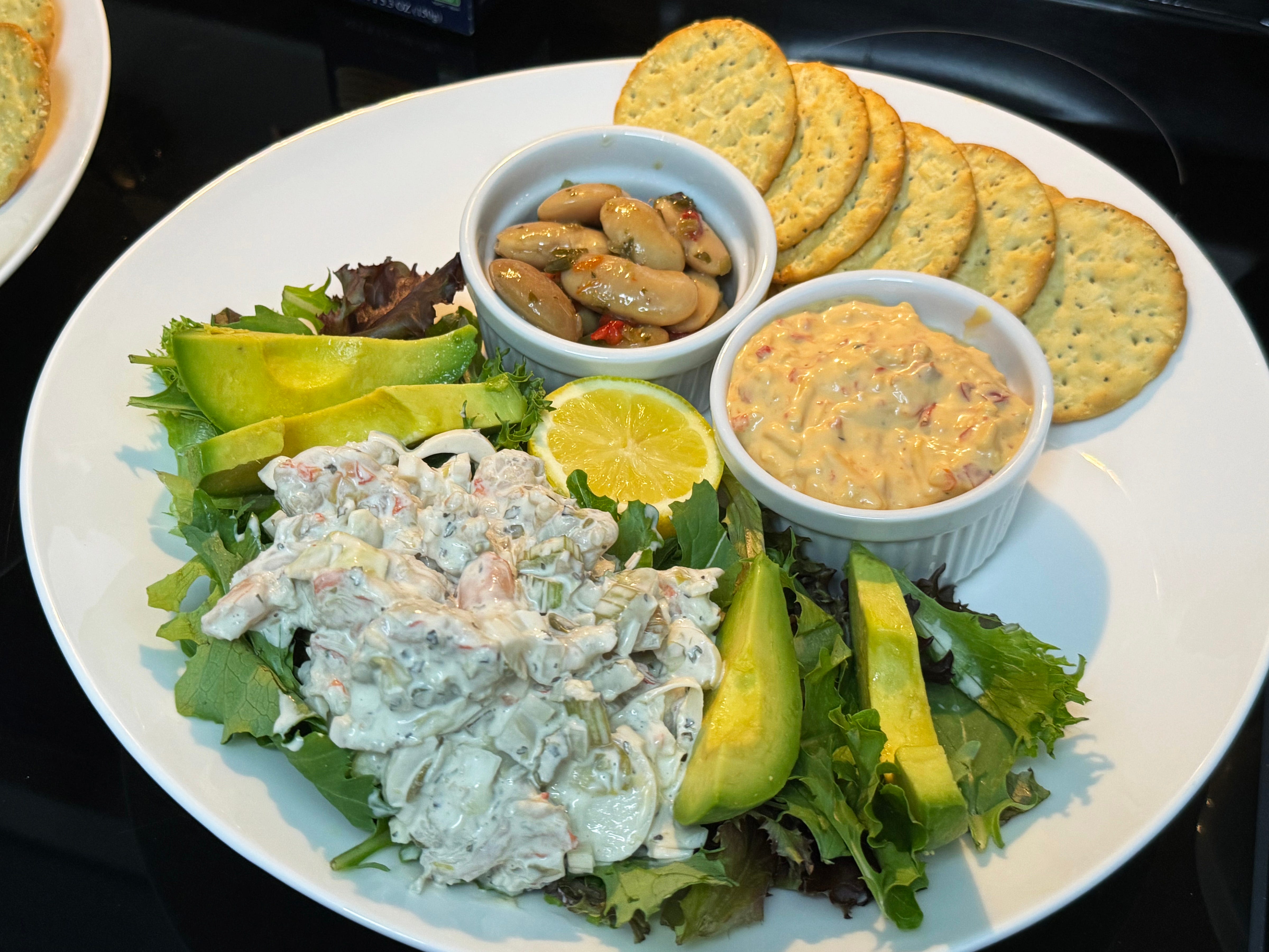 Gigante beans, shrimp salad, lemon and pimento cheese (plated) with a spring mix and sliced avocado. The beans, shrimp, cheese and lemon was part of our haul from Paradise Seafood & Gourmet Market, Marco Island.